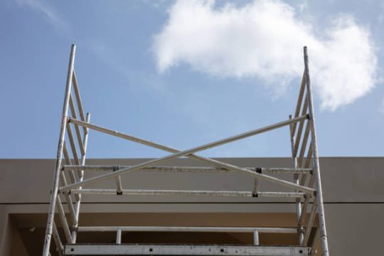 Modular scaffolding system installed on commercial building exterior