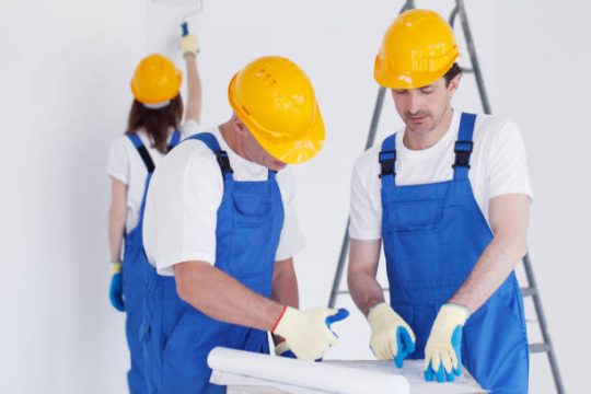 Maintenance team preparing materials during indoor repair work