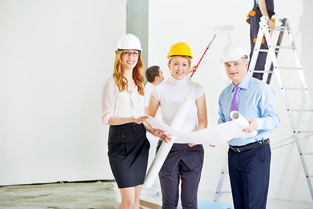 Construction team reviewing plans for scaffold access and work platforms